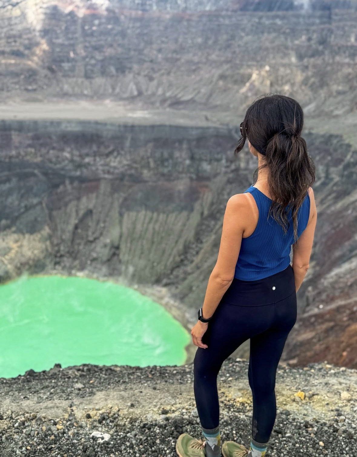 Hikers on Santa Ana Volcano Tour overlooking the turquoise crater lake in El Salvador